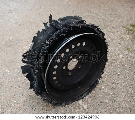 damaged tire after tire explosion at high speed on highway