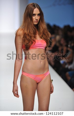 LOS ANGELES - OCTOBER 19: Model walks runway at the Culture Swimwear Fashion Show for SS 2013 at Sunset Gower Studios during Los Angeles Fashion Weekend on October 19, 2012 in Los Ageles, CA