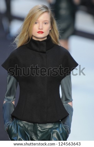 PARIS, FRANCE - MARCH 02: A model walks the runway during the Guy Laroche Ready to Wear Fall/Winter 2011 show as part of the Paris Fashion Week on March 02, 2011