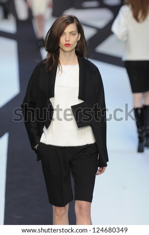 PARIS, FRANCE - MARCH 02: A model walks the runway during the Guy Laroche Ready to Wear Fall/Winter 2011 show as part of the Paris Fashion Week on March 02, 2011
