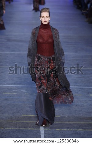 PARIS, FRANCE - MARCH 06: A model walks the runway at the Kenzo fashion show during Paris Fashion Week on March 6, 2011 in Paris, France.