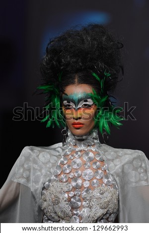 NEW YORK - FEBRUARY 15: Model walking the runway at Catalin Botezatu fashion show at The New Yorker Hotel during Couture Fashion Week on February 15, 2013 in New York City