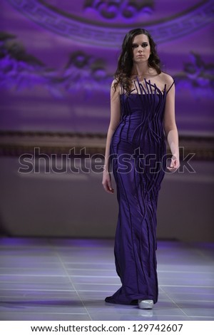 NEW YORK - FEBRUARY 16:  A Model walks on the Loula Loi Alafoyiannis fashion runway at The New Yorker Hotel during Couture Fashion Week on February 16, 2013 in New York City