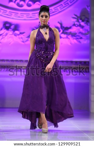 NEW YORK - FEBRUARY 17:  A Model walks on the Lourdes Atencio fashion runway at The New Yorker Hotel during Couture Fashion Week on February 17, 2013 in New York City