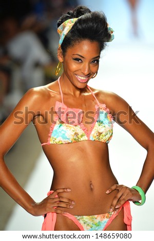 MIAMI BEACH, FL - JULY 20: A model walks the runway at the Nicolita show during Mercedes-Benz Fashion Week Swim 2014 at the Raleigh on July 20, 2013 in Miami Beach, Florida.