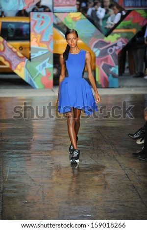 NEW YORK, NY - SEPTEMBER 08: A model walks the runway at DKNY Women\'s Spring 2014 fashion show during Mercedes-Benz Fashion Week Spring 2014 on September 8, 2013 in New York City.
