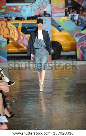 NEW YORK, NY - SEPTEMBER 08: A model walks the runway at DKNY Women\'s Spring 2014 fashion show during Mercedes-Benz Fashion Week Spring 2014 on September 8, 2013 in New York City.