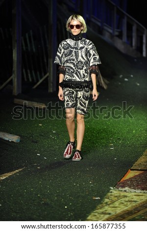 NEW YORK, NY - SEPTEMBER 12: A model walks the runway at the Marc Jacobs fashion show during Spring 2014 Mercedes-Benz Fashion Week on September 12, 2013 in New York City.