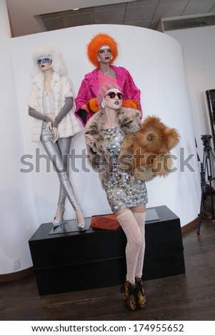 NEW YORK, NY - SEPTEMBER 09: A model poses in front of Mannequins at Helen Yarmak fashion presentation  during Mercedes-Benz Fashion Week Spring 2014 at The Crown Building on September 9, 2013 in NYC