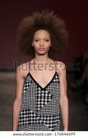 NEW YORK, NY - FEBRUARY 09: A model walks the runway at the DKNY Women\'s fashion show during Mercedes-Benz Fashion Week Fall 2014 on February 9, 2014 in New York City.