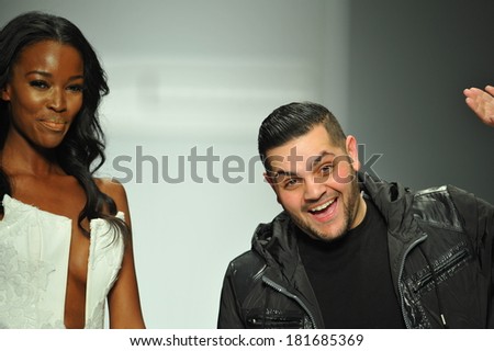 LOS ANGELES, CA - MARCH 10: Designer Michael Costello and model walks the runway at Michael Costello fashion show during Style Fashion Week Fall 2014 on March 10, 2014 in Los Angeles.