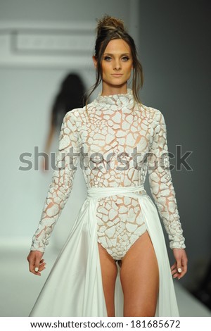LOS ANGELES, CA - MARCH 10: A model walks the runway at Michael Costello fashion show during Style Fashion Week Fall 2014 at The Live Arena on March 10, 2014 in Los Angeles.
