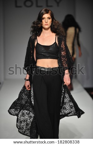 Los Angeles, CA - MARCH 13: A model walks the runway at Lolly Clothing fashion show during Style Fashion Week Fall 2014 at The LA Live Event Deck on March 13, 2014 in LA.