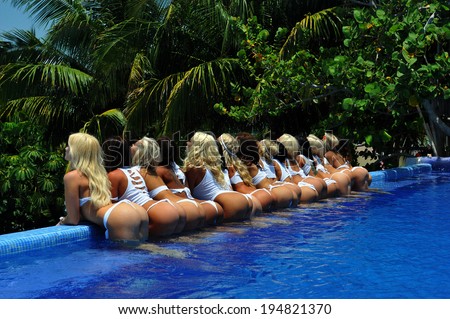CANCUN, MEXICO - MAY 05: Models poses outside for white t-shirt project during IBMS - International Bikini Model Search 2014 at the Oasis Sens Resort  on May 05, 2014 in Cancun, Mexico.