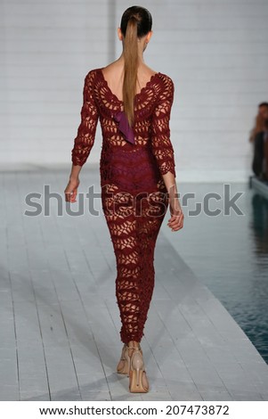 MIAMI - JULY 17: Model walks runway at Meskita collection at SoHo Beach House during Miami Swim Fashion Week on July 17, 2014 in Miami Beach Florida