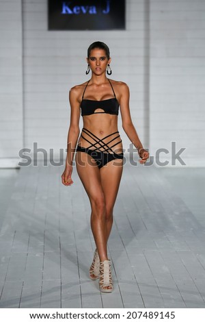 MIAMI - JULY 17: Model walks runway at Keva J. collection at SoHo Beach House during Miami Swim Fashion Week on July 17, 2014 in Miami Beach Florida