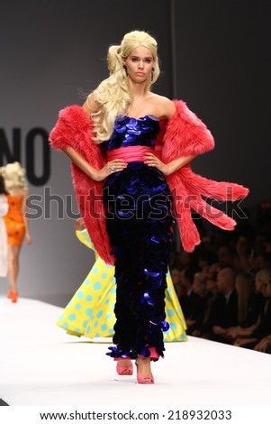 MILAN, ITALY - SEPTEMBER 18: A model walks the runway during the Moschino show as part of Milan Fashion Week Womenswear Spring/Summer 2015 on September 18, 2014 in Milan, Italy.