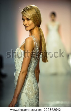 NEW YORK, NY - APRIL 11: A model walks the runway during the RIVINI Spring 2015 Bridal collection show at on April 11, 2014 in New York City.