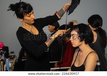NEW YORK, NY - OCTOBER 25: Models getting ready backstage with makeup and hair during Made in the USA Spring 2015 lingerie show at the Center 548 on October 25, 2014 in New York City.