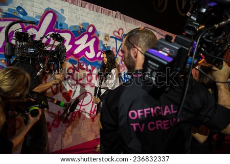 LONDON, ENGLAND - DECEMBER 02: Official TV Crew working backstage at the annual Victoria\'s Secret fashion show at Earls Court on December 2, 2014 in London, England.