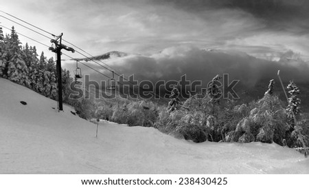 Snowy slope in the mountains, artistic black and white version