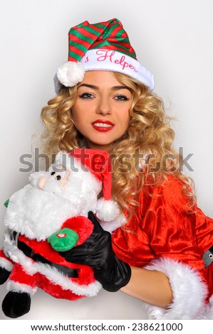 Sexy Santas Helper girl great image for creating Holiday Greeting postcards or computer wallpapers
