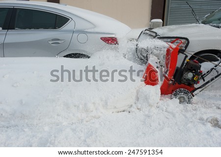 NEW YORK JANUARY 27: A building super clears the sidewalk on Emmons Ave in the Broooklyn, New York on Tuesday, January 27, 2015, the day after the snow blizzard of 2015.