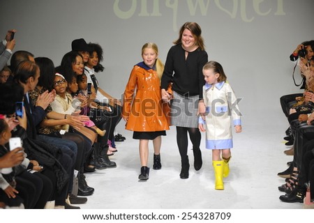 NEW YORK, NY - OCTOBER 18: Designer Amy Wismar walks the runway with models during the Oil & Water preview at petitePARADE / Kids Fashion Week on October 18, 2014 in New York City.