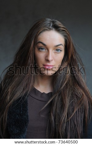 portrait of beautiful young brunette girl with no make-up