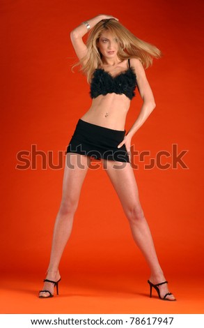 Young beautiful woman in In beautiful underwear and mini skirt in full height