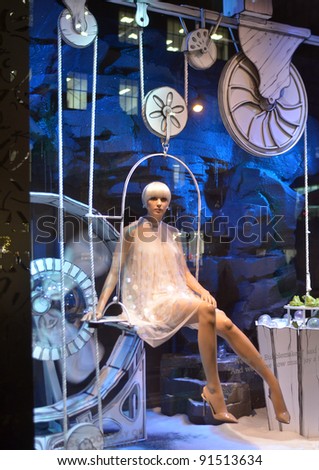 NEW YORK - DEC 19 : Spectators view holiday window display at Macy\'s at 50th street on December 19, 2011 in New York. This year\'s windows are inspired by a partnership with Make A Wish Foundation.