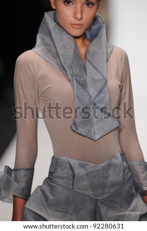 MOSCOW - OCTOBER 21: Model walks runway at the Lab 13 Collection for Spring/ Summer 2012 during Mercedes-Benz Fashion Week on October 21, 2011 in Moscow, Russia