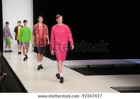 MOSCOW - OCTOBER 21: Male models walking runway at the Leonid Alexeev Collection for Spring/ Summer 2012 during Mercedes-Benz Fashion Week on October 21, 2011 in Moscow, Russia