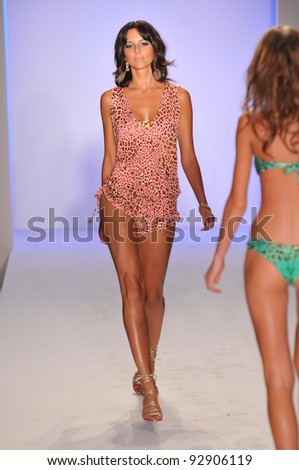 MIAMI - JULY 17: Model walking runway at the Luli Fama Collection for Spring/ Summer 2012 during Mercedes-Benz Swim Fashion Week on July 17, 2011 in Miami, FL