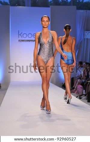 MIAMI - JULY 18: Model walking runway at the Kooey Swimwear Collection for Spring/ Summer 2012 during Mercedes-Benz Swim Fashion Week on July 18, 2011 in Miami, FL