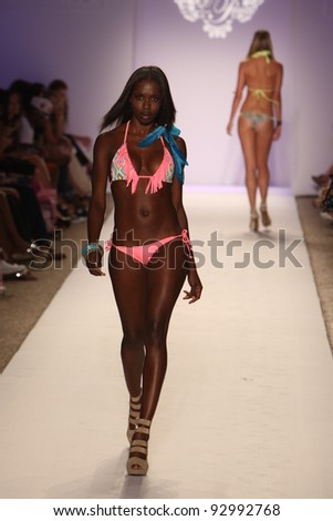 MIAMI - JULY 18: Model walking runway at the Have Faith Collection for Spring/ Summer 2012 during Mercedes-Benz Swim Fashion Week on July 18, 2011 in Miami, FL