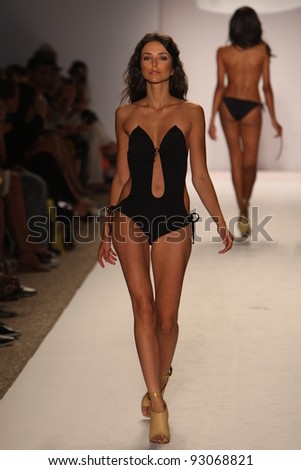 MIAMI - JULY 18: Model walks runway at the Perfect Tan Bikini Collection for Spring/ Summer 2012 during Mercedes-Benz Swim Fashion Week on July 18, 2011 in Miami, FL