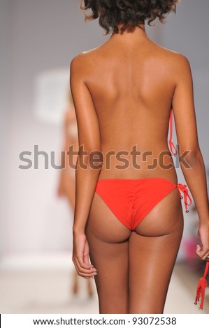 MIAMI - JULY 18: Model walks runway at the Perfect Tan Bikini Collection for Spring/ Summer 2012 during Mercedes-Benz Swim Fashion Week on July 18, 2011 in Miami, FL