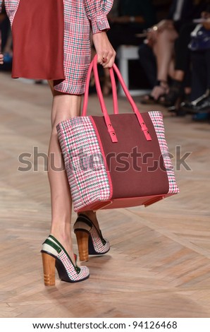 NEW YORK, NY - SEPTEMBER 11: A model wears Tommy Hilfiger Spring 2012 Women\'s Collection on the runway at The Theater at Lincoln Center on September 11, 2011 in New York City.