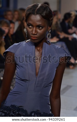 NEW YORK - SEPTEMBER 11: Model walks the runway at the Zac Pozen S/S 2012 collection presentation during Mercedes-Benz Fashion Week on September 11, 2011 in New York.