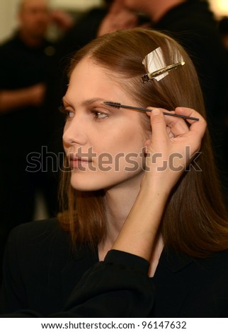NEW YORK - FEBRUARY 11: A Model gets ready backstage for Sally La Pointe Fall/Winter 2012 presentation in Center 548 during New York Fashion Week on February 11, 2012 in NYC.