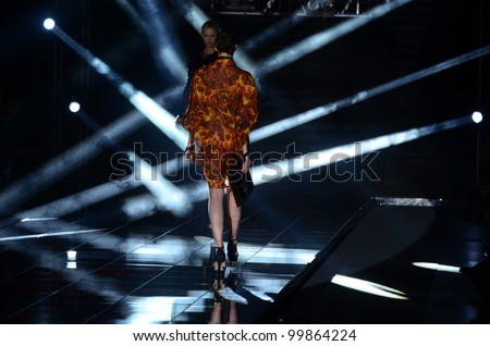 MOSCOW - APRIL 08: A Model walks runway at the Dmitri Loginov Fall Winter 2012 runway presentation during Volvo Fashion Week on April 08, 2012 in Moscow, Russia