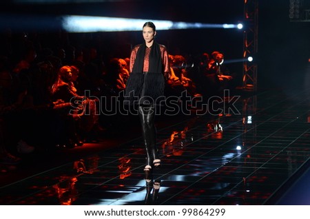 MOSCOW - APRIL 08: A Model walks runway at the Dmitri Loginov Fall Winter 2012 runway presentation during Volvo Fashion Week on April 08, 2012 in Moscow, Russia