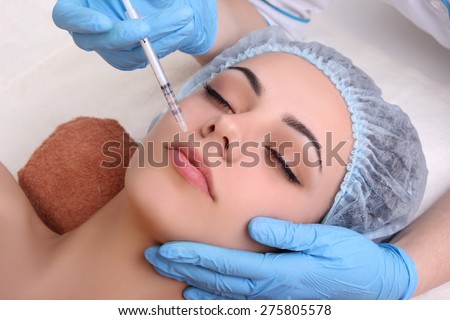 Beautiful girl on rejuvenation procedure in beauty clinic