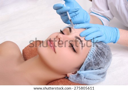 Beautiful girl on rejuvenation procedure in beauty clinic
