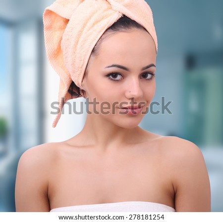 Spa skin care beauty woman wearing hair towel after beauty treatment. Beautiful multiracial young woman with perfect skin.