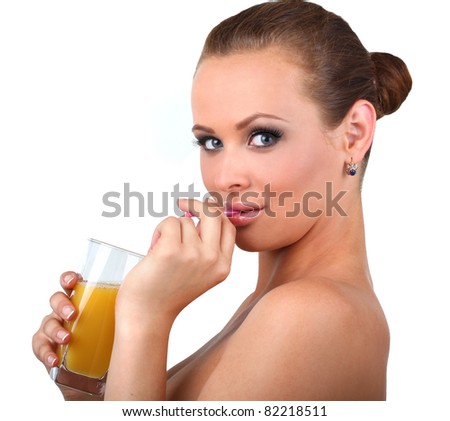 The beautiful woman drinks orange fresh on the isolated white background