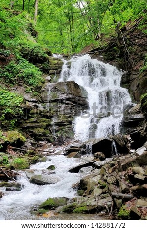 Waterfall in forest. In the deep forest on mountain