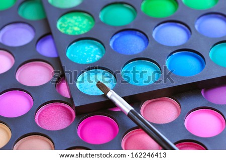 Professional eye shadows palette with makeup brush. Makeup background