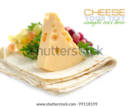 Piece of cheese with greenery on a pita